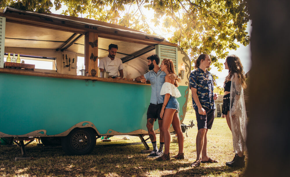 Festival attendees buying food at truck